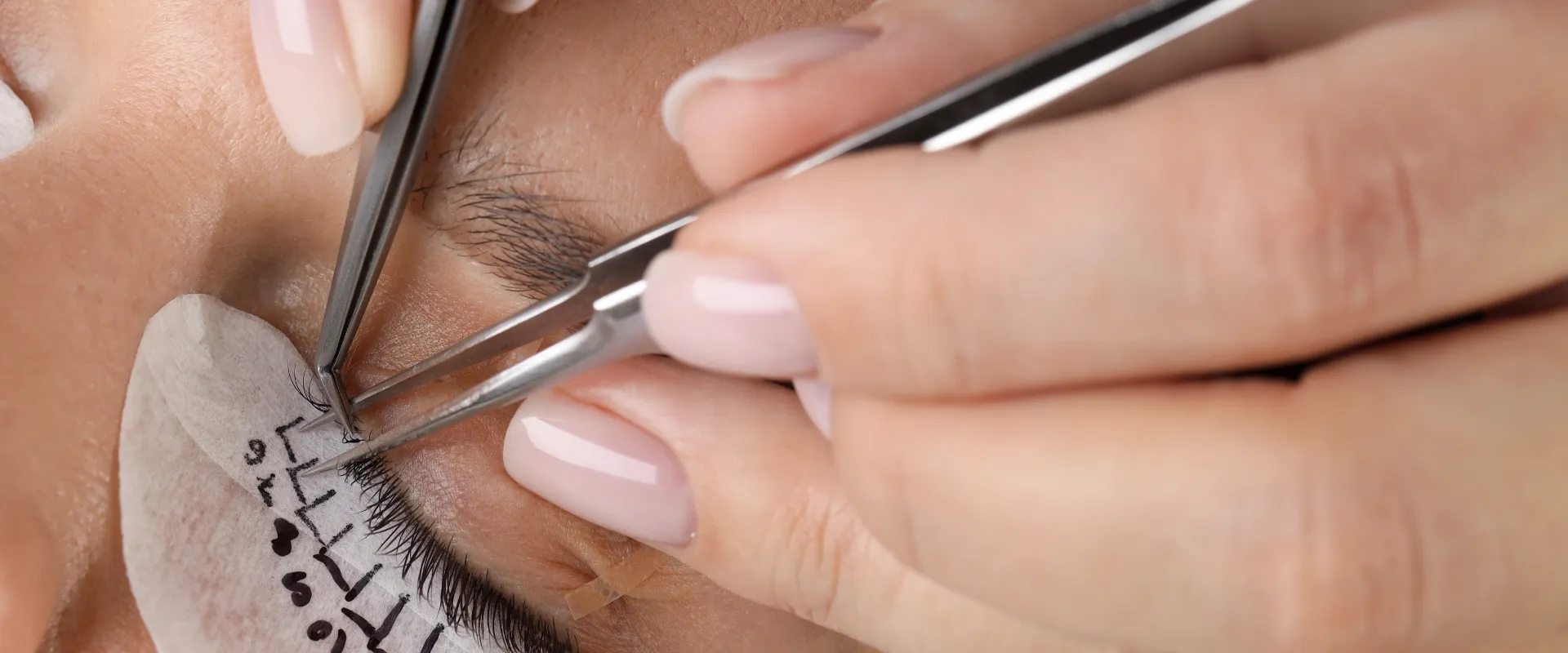 Professional lash tools on a salon workstation