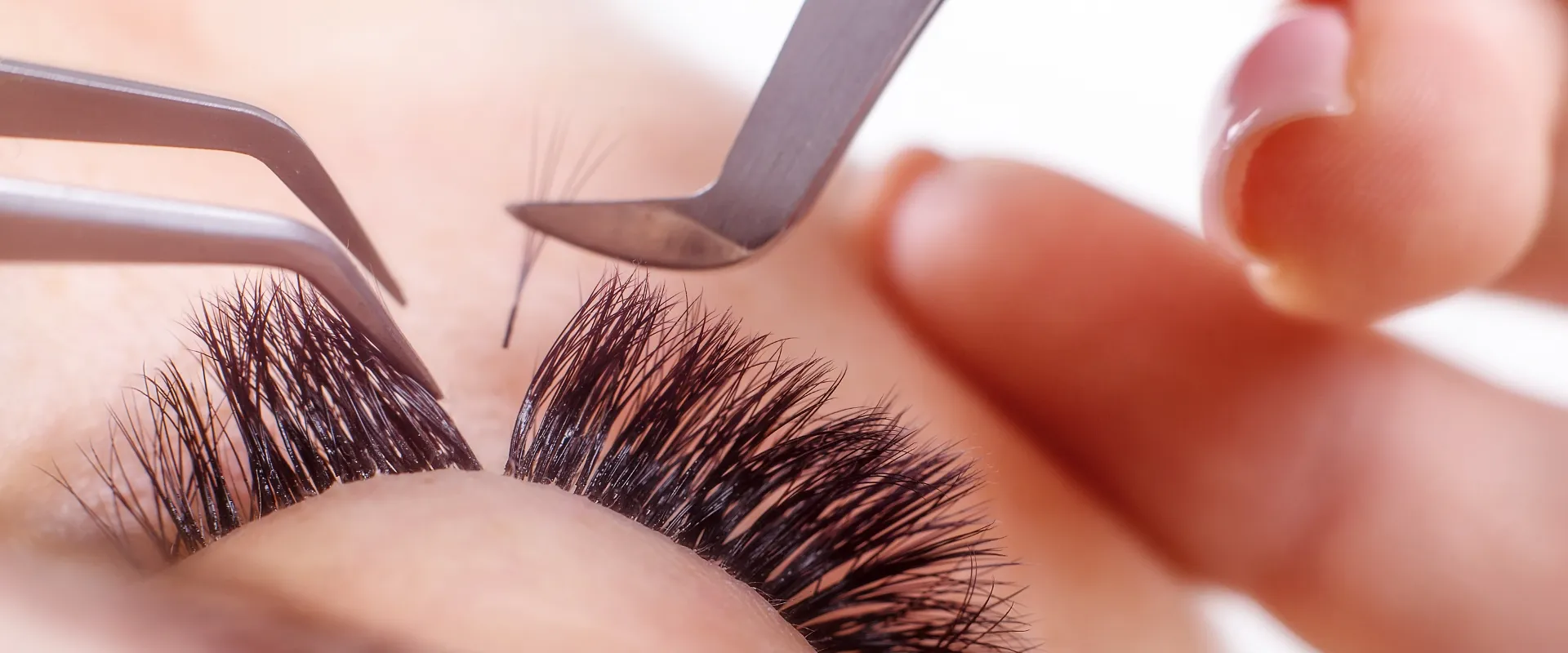 Professional lash tools on a salon workstation