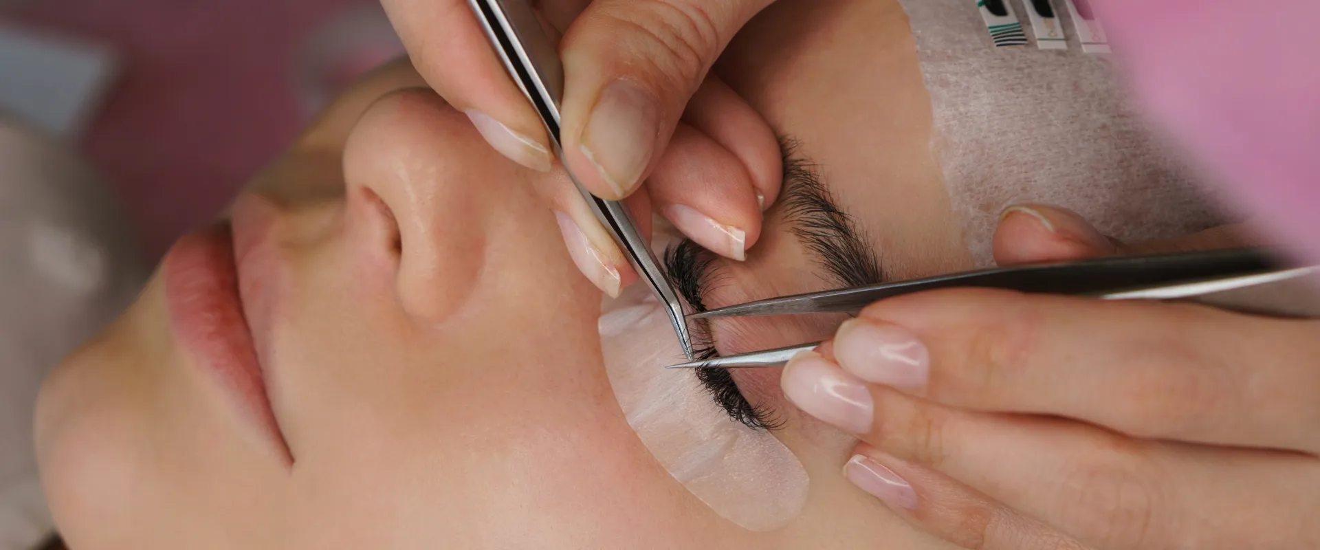 Professional lash tools on a salon workstation