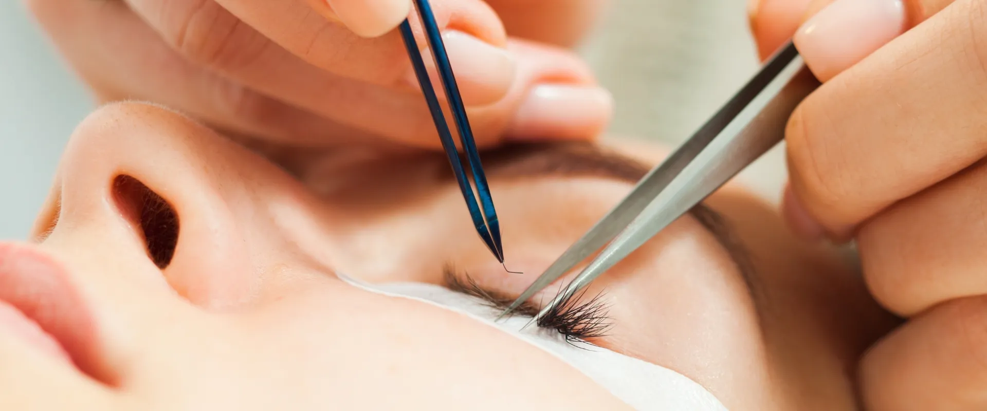 Lash artist using lash lift & tint tweezers
