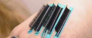 Close view of lash strips with extensions during a professional application