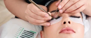 Applying an extension to an isolated natural lash at the lash line